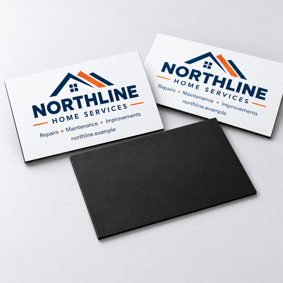 Two magnetic business cards with the magnetic back, angled view