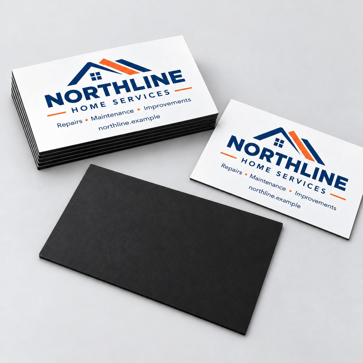 Stack of magnetic business cards next to the magnetic backing