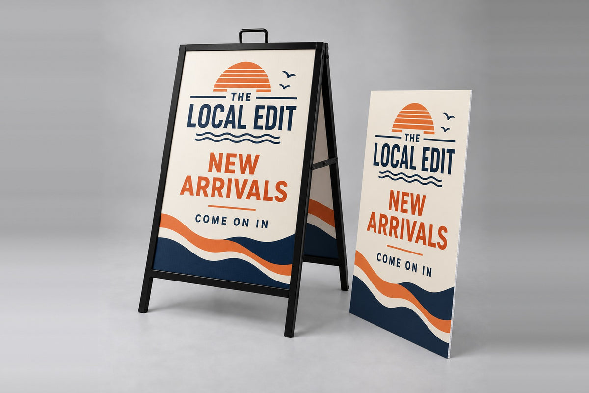 Printed coroplast A-frame insert beside a metal A-frame sign