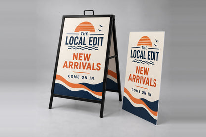 Printed coroplast A-frame insert beside a metal A-frame sign